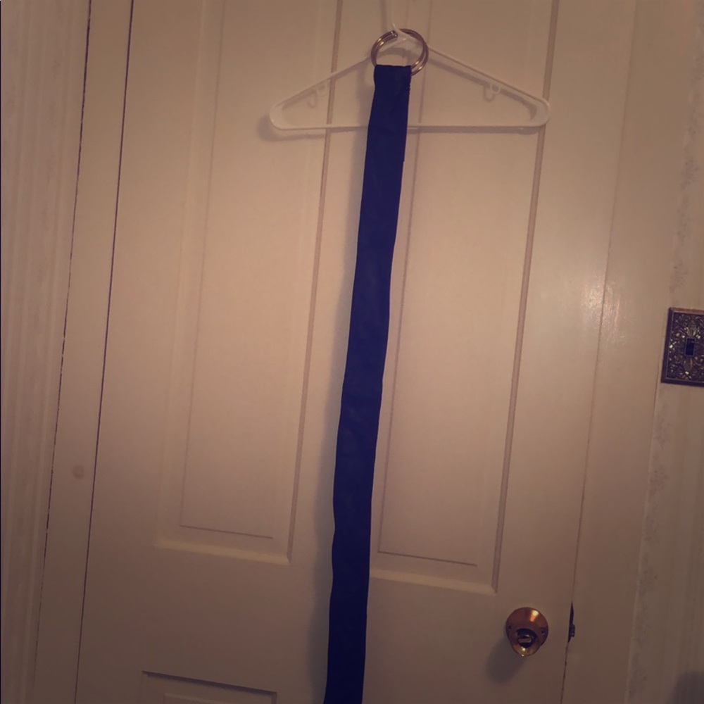 Black soft leather belt with silver hook at top. Very fitted. In great condition